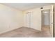 Spacious bedroom with carpet flooring and mirrored closet doors at 120 Hibiscus Woods Ct # 8D, Deltona, FL 32725