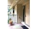 Condo entrance with balcony and potted plant at 120 Hibiscus Woods Ct # 8D, Deltona, FL 32725