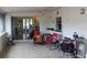 Cozy indoor porch with seating and access to the outdoors at 4663 Montauk St, Orlando, FL 32808