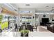 Kitchen dining area with lake views, a table for six, and stylish window blinds at 5094 Otters Den Trl, Sanford, FL 32771