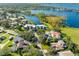 Aerial view showcasing the property's waterfront location and community at 8984 Houston Pl # 103, Orlando, FL 32819