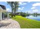 Charming backyard with brick patio and lake view at 8984 Houston Pl # 103, Orlando, FL 32819