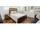 Cozy bedroom with dark wood frame bed and built-in shelves at 8984 Houston Pl # 103, Orlando, FL 32819