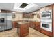 Modern kitchen with stainless steel appliances and granite island at 8984 Houston Pl # 103, Orlando, FL 32819
