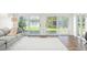 Bright living room with water views and sliding glass doors at 8984 Houston Pl # 103, Orlando, FL 32819