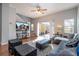Spacious living room with large TV and access to backyard at 8581 Bay Lilly Loop, Kissimmee, FL 34747