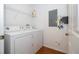 Convenient laundry room with washer, dryer, and shelving at 8581 Bay Lilly Loop, Kissimmee, FL 34747