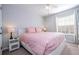 Bedroom with a pink comforter and plenty of closet space at 8581 Bay Lilly Loop, Kissimmee, FL 34747