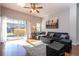 Bright living room with sliding doors leading to pool area at 8581 Bay Lilly Loop, Kissimmee, FL 34747