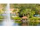 Relaxing gazebo by the lake with fountain and lush landscaping at 8581 Bay Lilly Loop, Kissimmee, FL 34747