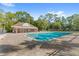 Community pool with a pavilion and lounge chairs at 4406 Brookstone Ct, Orlando, FL 32826