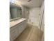 Updated bathroom with a shower/tub combo and vanity at 5124 Park Central Dr # 513, Orlando, FL 32839