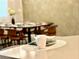 Kitchen island with a mug and bowl; dining area visible in the background at 2104 Fleming Mist Pl, Kissimmee, FL 34747