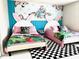 Alice in Wonderland themed bedroom with twin beds and whimsical decor at 2104 Fleming Mist Pl, Kissimmee, FL 34747