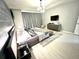 Spacious primary bedroom with modern decor and hardwood floors at 2104 Fleming Mist Pl, Kissimmee, FL 34747