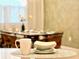 Kitchen island with a mug and bowl; dining area visible in the background at 2104 Fleming Mist Pl, Kissimmee, FL 34747