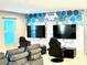 Game room with two large TVs at 2104 Fleming Mist Pl, Kissimmee, FL 34747