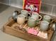 Coffee maker and coffee mugs on a wooden tray at 2104 Fleming Mist Pl, Kissimmee, FL 34747