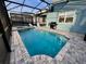 Inviting swimming pool with spa and screened enclosure at 2104 Fleming Mist Pl, Kissimmee, FL 34747