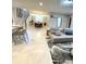 Open living room featuring a sectional sofa and large area rug at 2104 Fleming Mist Pl, Kissimmee, FL 34747