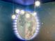 Close-up of a celestial-themed bedroom's light fixture, with a moon mural as a backdrop at 2104 Fleming Mist Pl, Kissimmee, FL 34747