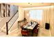 Bright dining room with a large table and modern light fixture at 2104 Fleming Mist Pl, Kissimmee, FL 34747