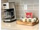 Coffee maker and coffee mugs on a wooden tray at 2104 Fleming Mist Pl, Kissimmee, FL 34747