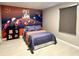 Bedroom with Space Jam mural, full-size bed, and window coverings at 2104 Fleming Mist Pl, Kissimmee, FL 34747