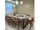 Elegant dining room featuring a long table and leather chairs at 2104 Fleming Mist Pl, Kissimmee, FL 34747