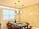 Modern dining room with a large table at 2104 Fleming Mist Pl, Kissimmee, FL 34747