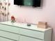 White dresser with pink accents in a pink bedroom at 2104 Fleming Mist Pl, Kissimmee, FL 34747