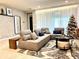 Cozy living room with sectional sofa and a Christmas tree at 2104 Fleming Mist Pl, Kissimmee, FL 34747