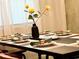 Modern dining room featuring a dark wood table with seating for six at 2104 Fleming Mist Pl, Kissimmee, FL 34747