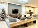 Modern living room with sectional sofa and built-in entertainment center at 2104 Fleming Mist Pl, Kissimmee, FL 34747