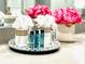 Bathroom vanity with decorative tray, towels, and toiletries at 2104 Fleming Mist Pl, Kissimmee, FL 34747