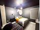 Space-themed bedroom with a gray bed and star ceiling at 2104 Fleming Mist Pl, Kissimmee, FL 34747