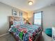 Superhero themed bedroom with full-size bed and window at 8931 Sydney Ave, Kissimmee, FL 34747