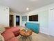 Living Room with sectional sofa and mid-century decor at 8931 Sydney Ave, Kissimmee, FL 34747