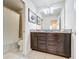 Bathroom with granite countertop double vanity, shower/tub combo at 8931 Sydney Ave, Kissimmee, FL 34747