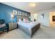 Main bedroom with Mickey and Minnie bedding and blue accent wall at 8931 Sydney Ave, Kissimmee, FL 34747