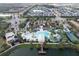 Community pool, water park, and clubhouse with tennis courts at 8931 Sydney Ave, Kissimmee, FL 34747