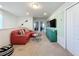 Open concept common area with sectional sofa and TV at 8931 Sydney Ave, Kissimmee, FL 34747