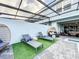 Private pool and patio with lush green artificial turf at 8931 Sydney Ave, Kissimmee, FL 34747
