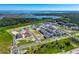 Aerial view of a new housing development near a lake at 344 Belmond Dr, Debary, FL 32713