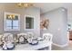 Bright dining room features a white table with seating for four and stylish decor at 7133 Carib Grackle Dr, Saint Cloud, FL 34773