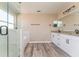 Elegant bathroom with double vanity, granite countertop, glass shower, and soaking tub at 1344 Holly Glen Run, Apopka, FL 32703