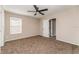 Spacious bedroom with carpeted floor, ceiling fan, and window with blinds at 1344 Holly Glen Run, Apopka, FL 32703