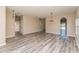 Spacious dining room with wood-look flooring and elegant light fixtures at 1344 Holly Glen Run, Apopka, FL 32703