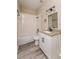 Clean bathroom with white vanity, granite countertop, and tile shower/tub at 1344 Holly Glen Run, Apopka, FL 32703