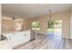 Kitchen with island, stainless steel appliances, and sliding glass doors to backyard at 1344 Holly Glen Run, Apopka, FL 32703